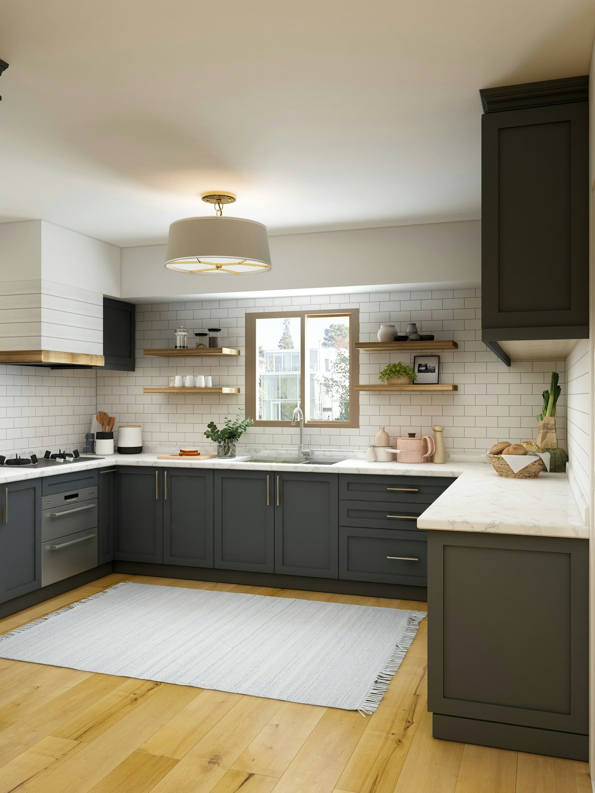 Deep green painted kitchen cabinets with brass pulls and a white tile backsplash