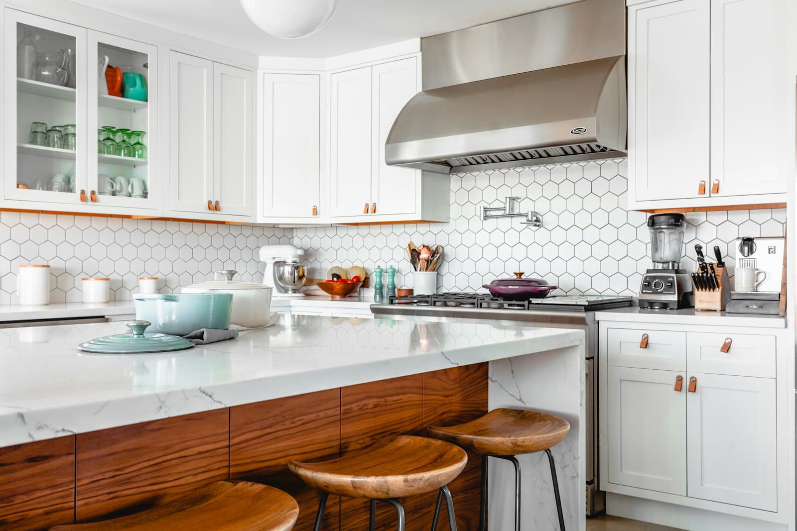 White shaker cabinets with a walnut island